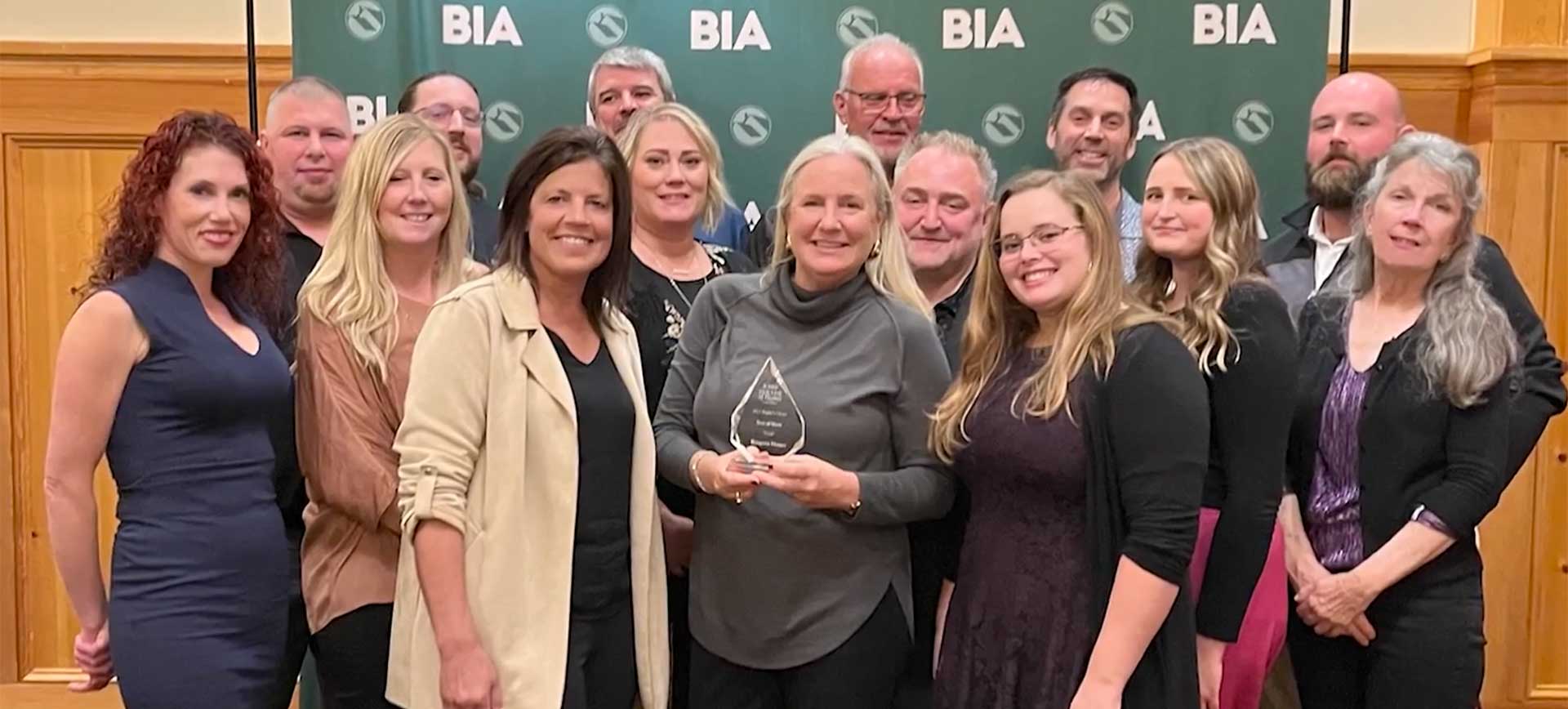 Erin Wriston receives an award for Kingston Homes